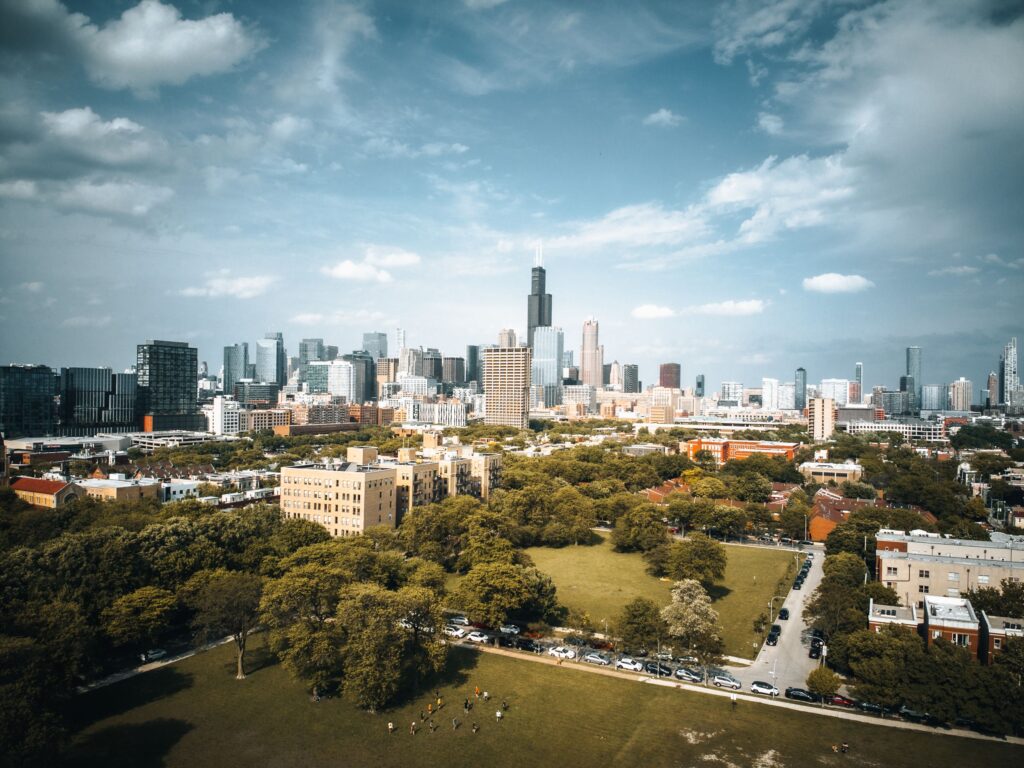 Stunning aerial shot of Chicago's skyline with visible Willis Tower under a blue sky.